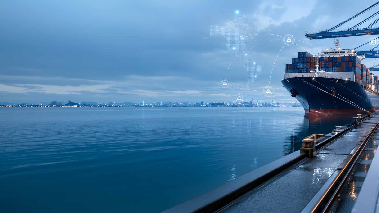 A container ship berthed at a port at dusk, with a connected world map overlay